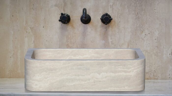 Troia light travertine rectangular vessel sink honed and filled w18 l275 h7 SPTLTR20 room shot sink view